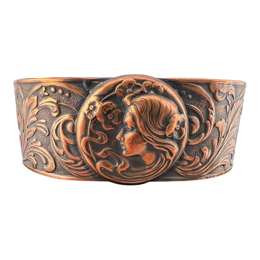 Copper cuff featuring a flower girl in Art Nuevo style