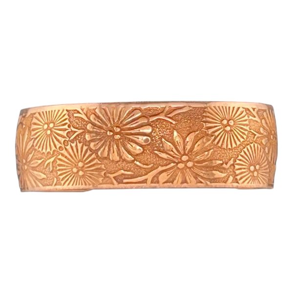 Natural patina copper cuff with flowers in a starburst pattern