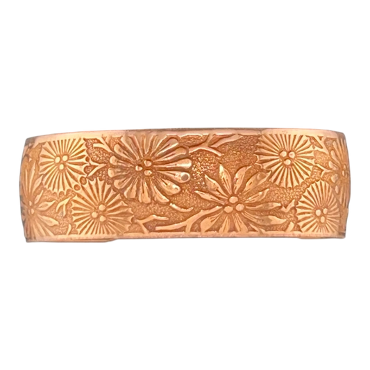 Natural patina copper cuff with flowers in a starburst pattern
