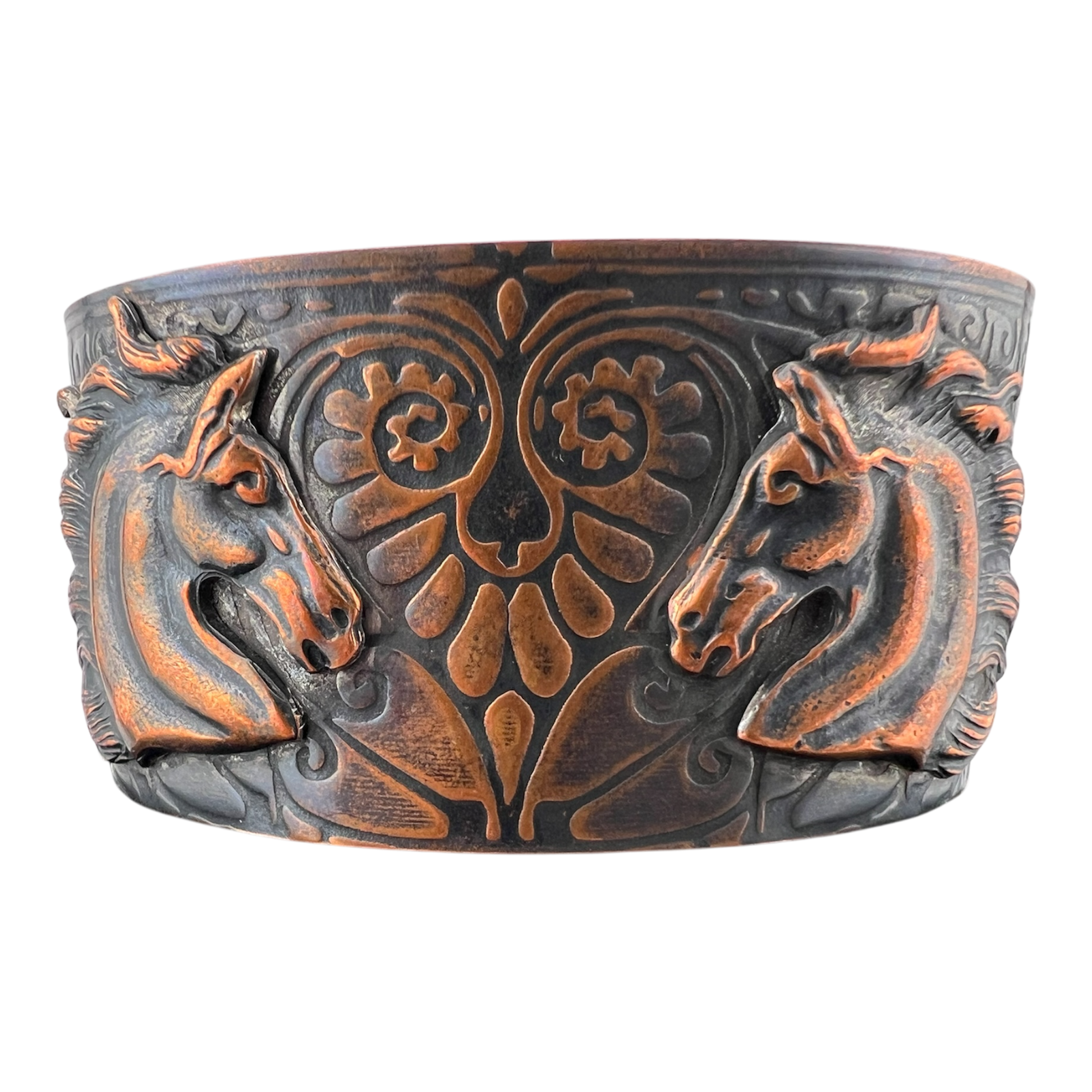 The lovers copper cuff featuring heart patterned band with two horses facing each other