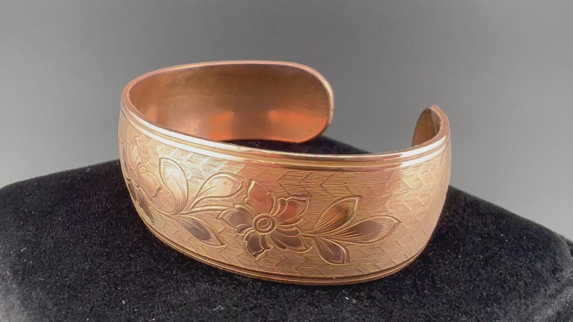 Video copper domed cuff with leafy flower pattern