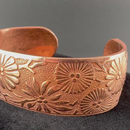 Video of Copper cuff with flowers in a st