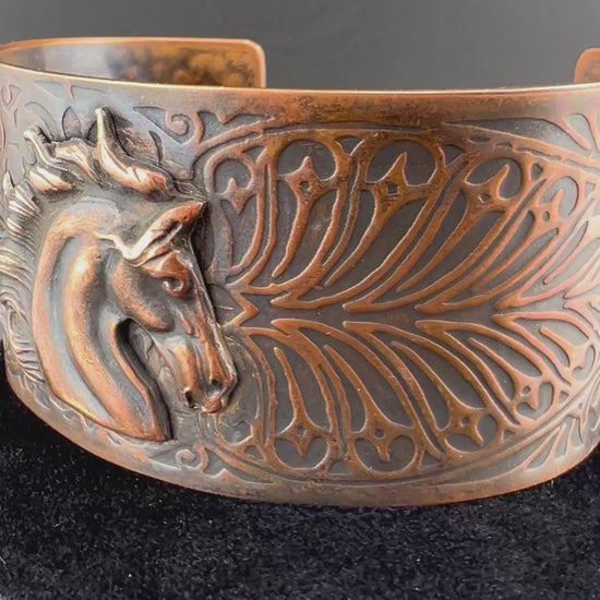 Video of copper leafy pattern cuff with horse head accent Aged patina