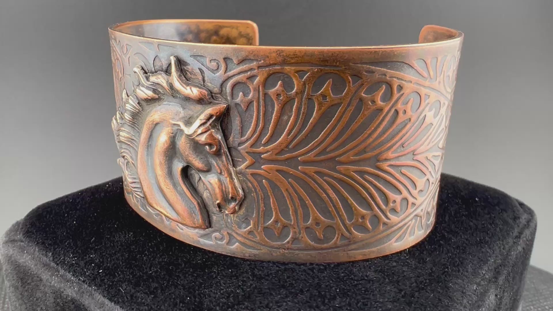Video of copper leafy pattern cuff with horse head accent Aged patina